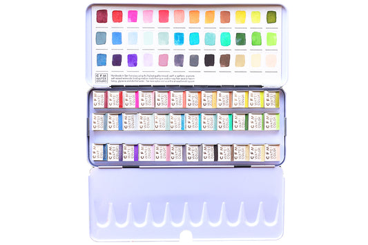 Case for Making pans filled with handmade watercolor paint, ready to be placed into the 36-Color Ultimate Feels Blends Watercolor Palette.