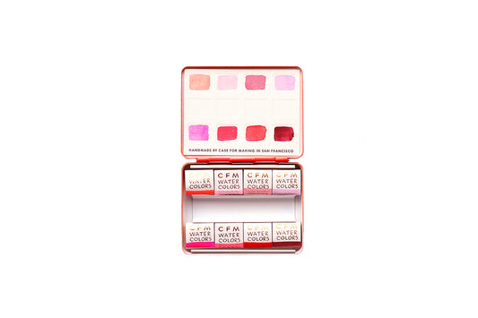 Case for Making pans filled with handmade watercolor paint, ready to be placed into the 8-Color Monochromatic Red Watercolor Travel Palette.