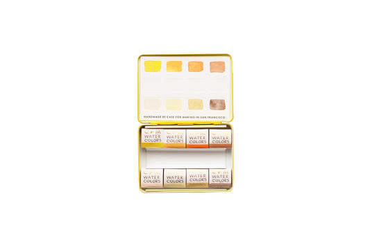 Case for Making pans filled with handmade watercolor paint, ready to be placed into the 8-Color Monochromatic Yellow Watercolor Travel Palette.