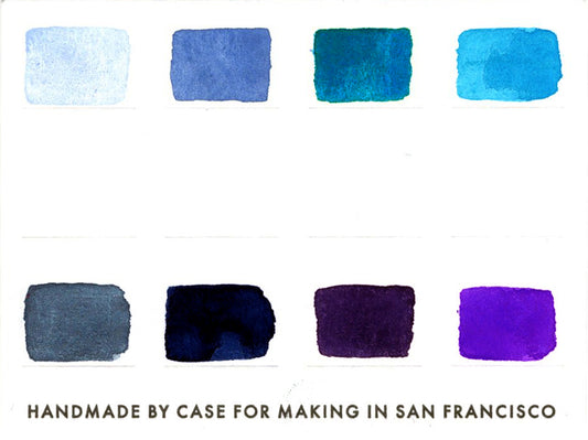 A close-up of the pre-painted swatch card for the 8-Color Monochromatic Blue Watercolor Travel Palette.