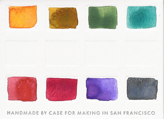 A close-up of the pre-painted swatch card for the 8-Color Ultra-Blends Watercolor Travel Palette.