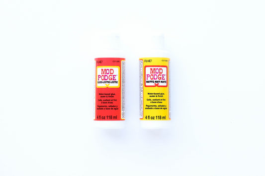 Mod Podge, a total classic. Use as a glue, sealer, finish, or all-in-one! Perfect for collaging.