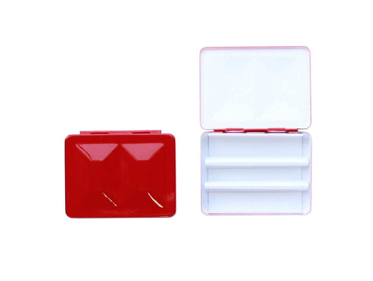 The CfM Simple Travel Palette in Glossy French Vermilion. Shown closed and open, side by side. The open case features wells in the lid for mixing colors and can fit a removable swatch card.