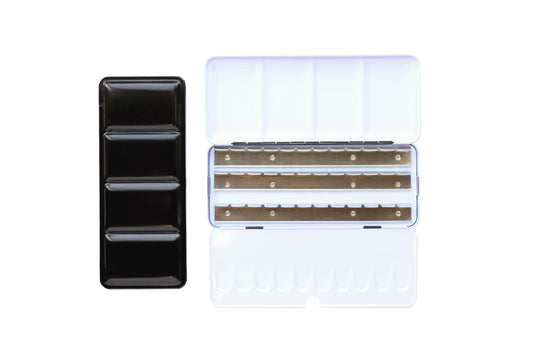 Large Empty Palette - a closed palette beside an open palette. The exterior is shiny black and the inside is shiny white with mixing space in the lids. Interior shows 3 empty metal rows that the pans of watercolor clip securely into.