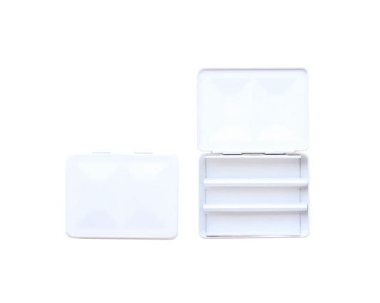 The CfM Simple Travel Palette in Matte White. Shown closed and open, side by side. The open case features wells in the lid for mixing colors and can fit a removable swatch card.