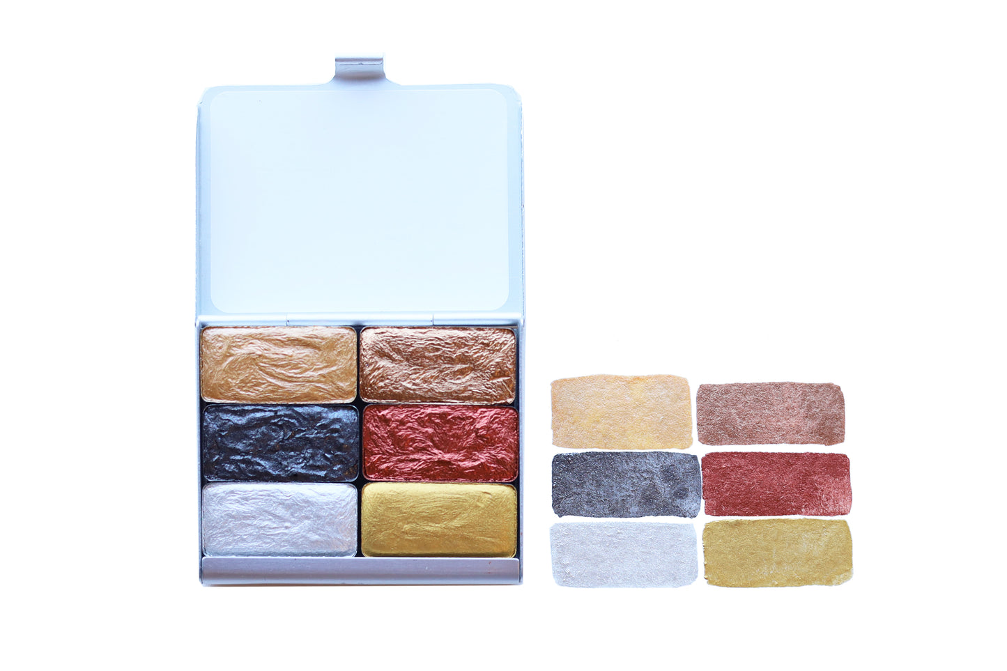 A close-up of the pre-painted swatch card for the Metallics Art Toolkit Watercolor Palette.
