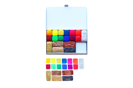 A close-up of the pre-painted swatch card for the Brights + Metallics Art Toolkit Watercolor Palette.