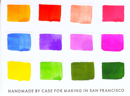 A close-up of the pre-painted swatch card for the 12-Color Floral Watercolor Travel Palette.