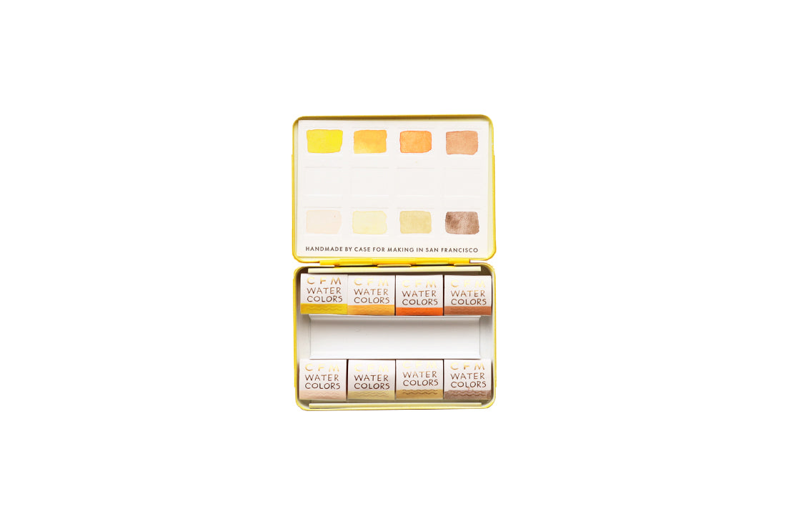 Case for Making pans filled with handmade watercolor paint, ready to be placed into the 8-Color Monochromatic Yellow Watercolor Travel Palette.