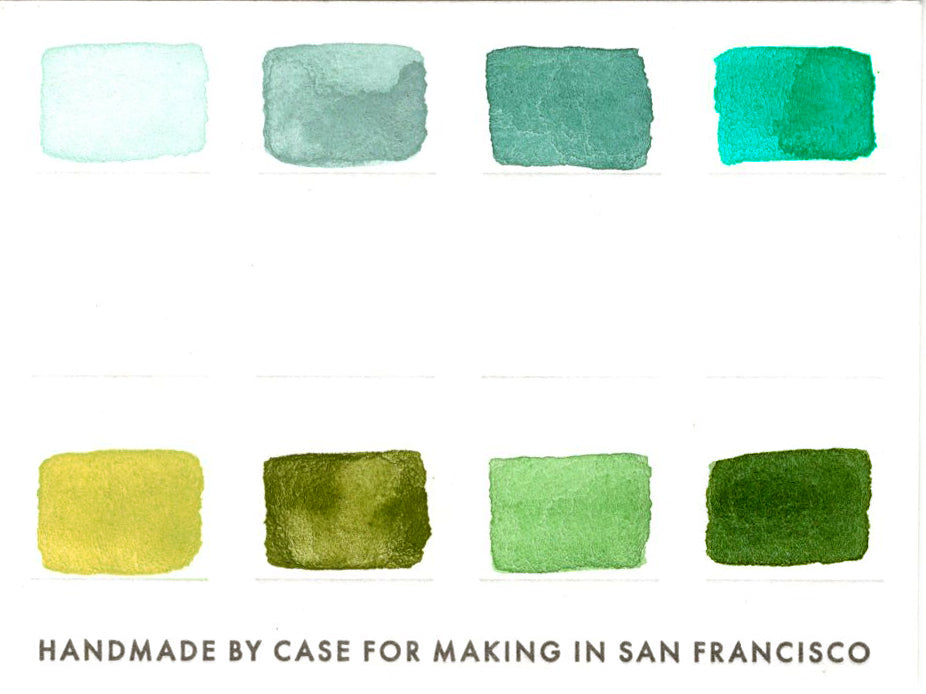 A close-up of the pre-painted swatch card for the 8-Color Monochromatic Green Watercolor Travel Palette.