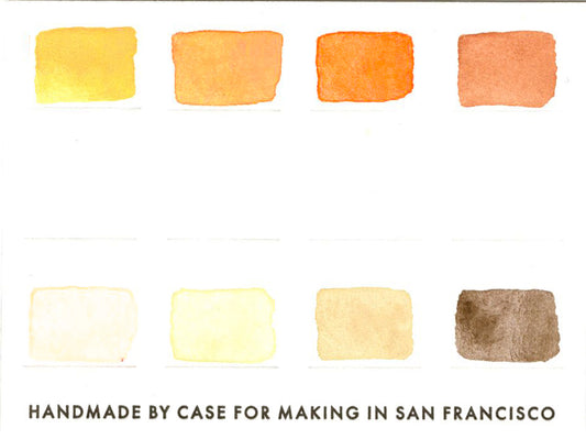 A close-up of the pre-painted swatch card for the 8-Color Monochromatic Yellow Watercolor Travel Palette.