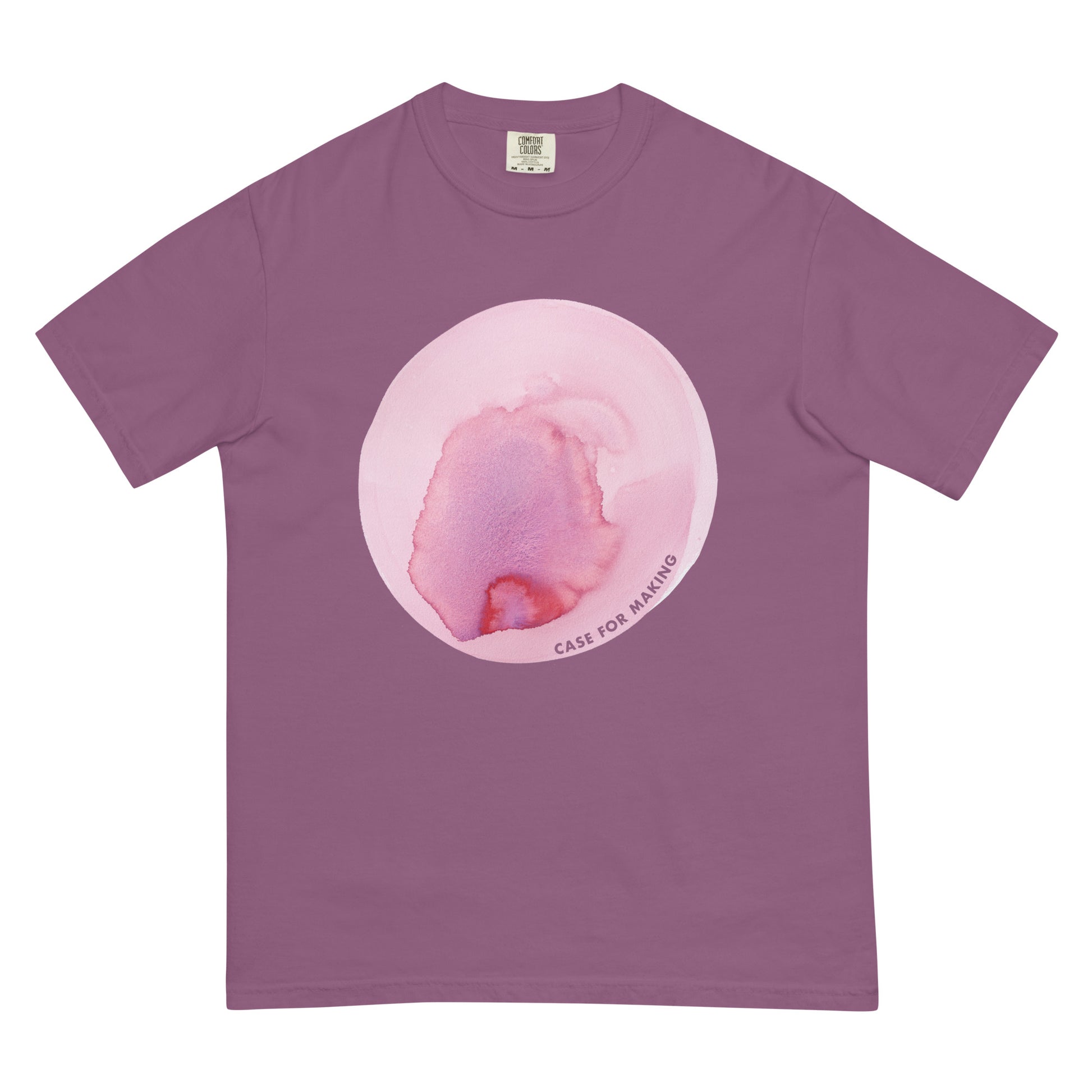 The CfM Blossom Circle Swatch Tee, a Comfort Colors t-shirt printed with a large circle swatch of CfM Blossom watercolor paint.