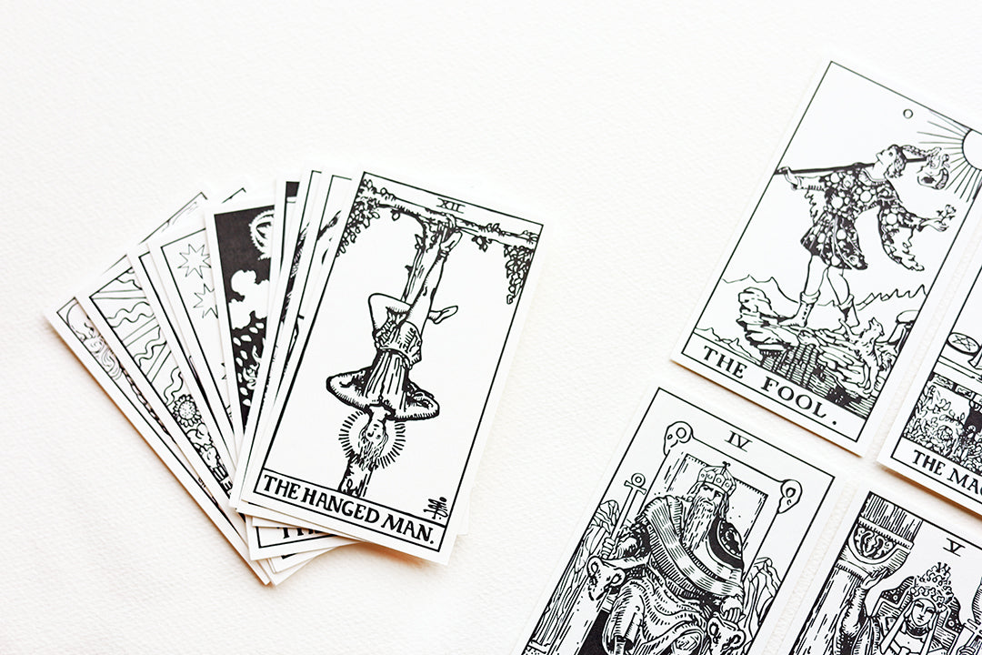 A close up of a few Watercolor Tarot Cards.