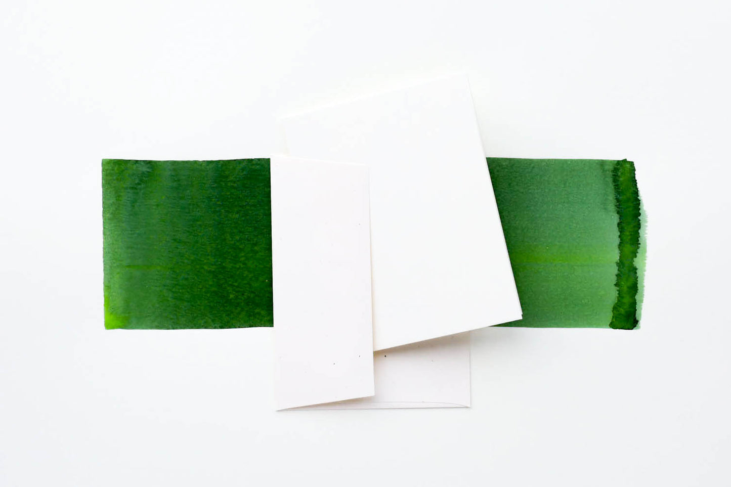 The white cold press folded card with the accompanying white envelope.