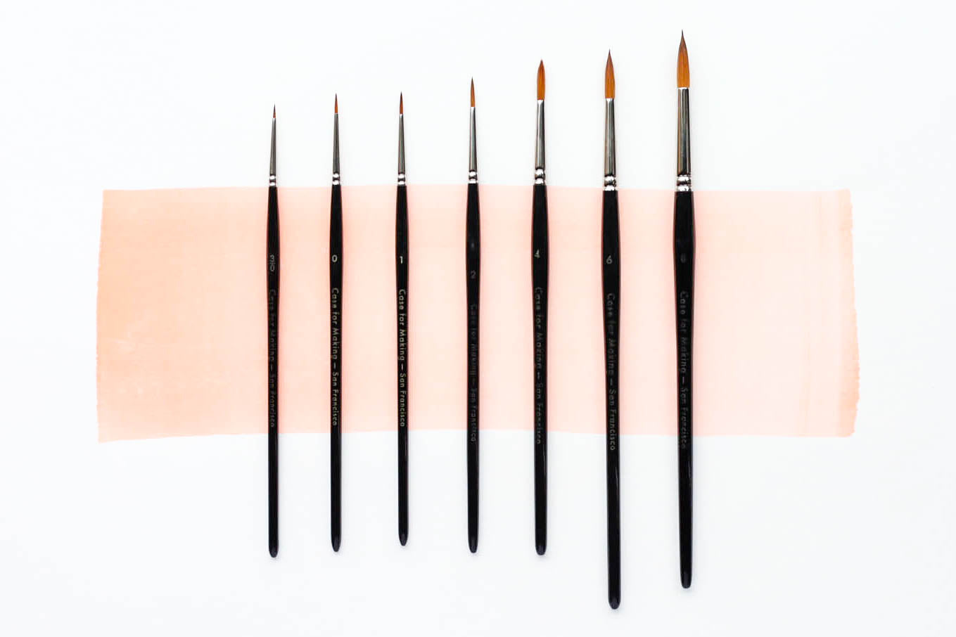 Seven sizes in a row of the Case for Making Round Brushes.  From left to right: size 3/0, size 0, size 1, size 2, size 4, size 6, size 8.