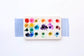 A close-up of the pre-painted swatch card for the CfM + Cloutier Ceramics Fillable Mixing Palette.