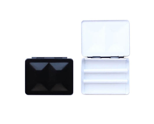 The CfM Simple Travel Palette in Matte Black.  Shown closed and open, side by side. The open case features wells in the lid for mixing colors and can fit a removable swatch card.